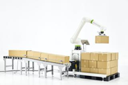 主力ロボット①「Palletizy」（パレタイジー）。箱や袋の積み・降ろし作業を行う。人1人分のスペースに収まり、直感的に操作でき、キャスターで簡単に移動もできる。30kgの重さまで掴みあげられるため、小さい製造ラインでの重労働を自動化できる切り札として人気の商品。 