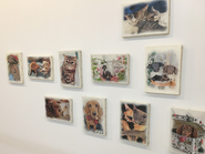 オフィスの壁にはスタッフのペットのポートレートを飾っています。ねこやペットへの愛が私たちの原動力です。