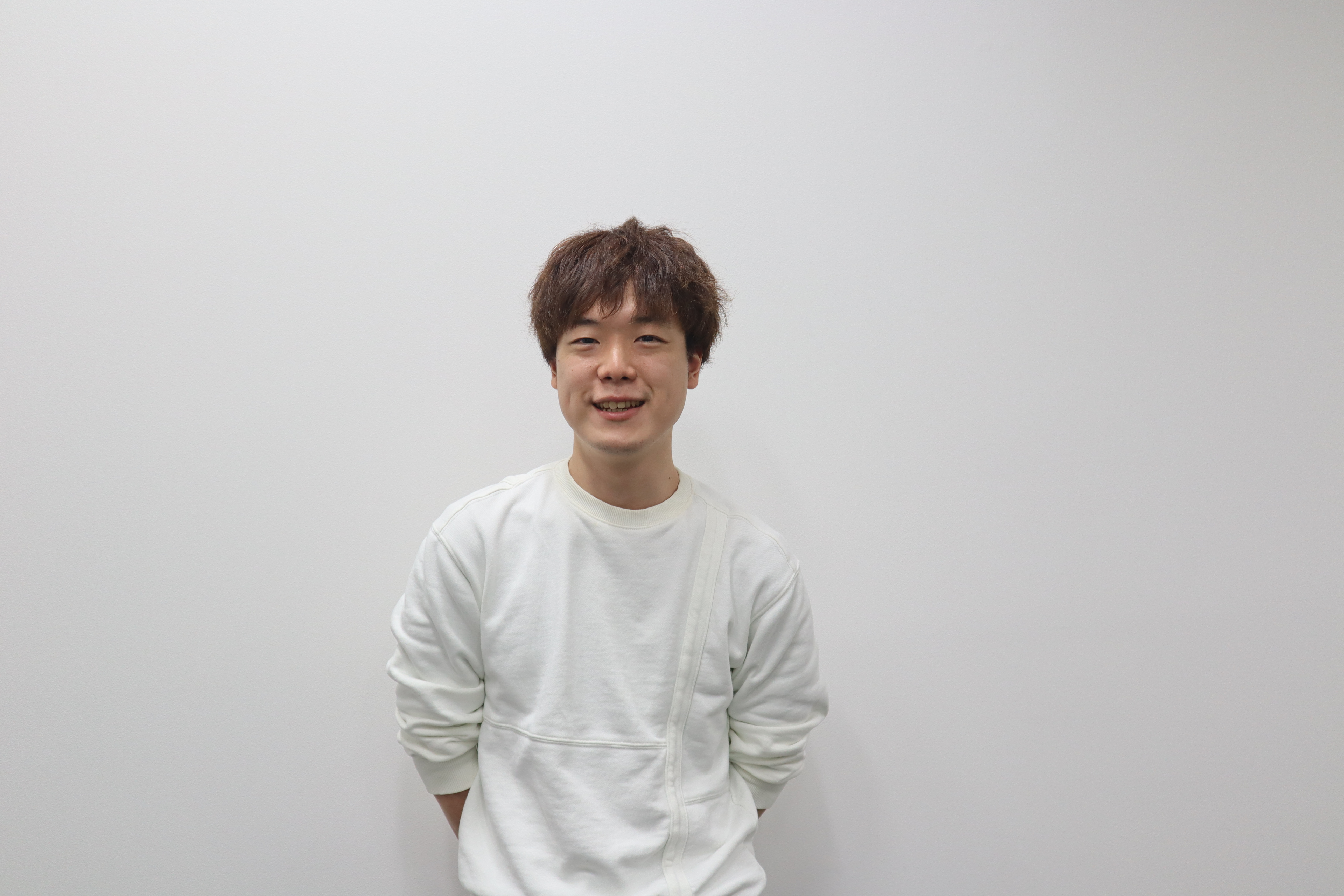 組織を横断すると、一段上の景色が見えてくる。全社の技術的課題を解決したエンジニアの話