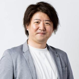 賢 石井